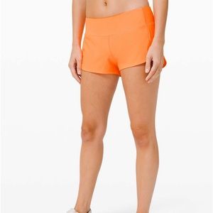Lululemon Speed Up Size 4 2.5 inch Highlighter Orange